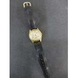A 9ct yellow gold mid sized Rolex manual wind wristwatch 15 jewel movement - 31mm wide including