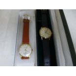 Two manual wind Gentlemen's watches, a boxed Record de Luxe,