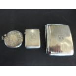 A silver hallmarked cigarette case, marked for Birmingham 1918/19,