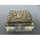 A Stourbridge glass paperweight stamp box,silver lid with embossed decoration,