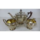 A silver hallmarked three piece tea service consisting of teapot,