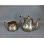 An electroplated Britannia metal teapot and twin handled sugar bowl of Art Nouveau form and