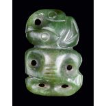 A Maori nephrite hei-tiki pendant 5cm high together with a photographic print of an actress