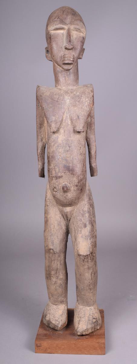 A Lobi standing female figure Burkino Faso 75cm high on a stand. - Image 2 of 4