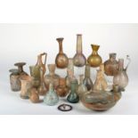 A collection of Roman glass vessels 2nd / 3rd century BC including five with ovoid bodies and long