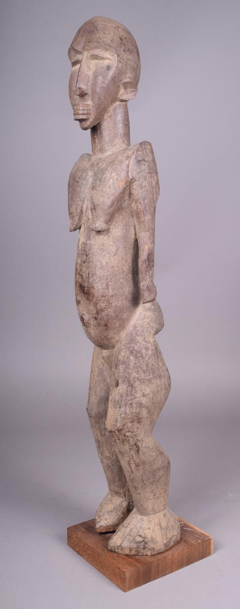 A Lobi standing female figure Burkino Faso 75cm high on a stand. - Image 3 of 4