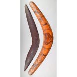 Two Aborigine boomerangs; one with incised and poker work decoration outline of Australia a hunter