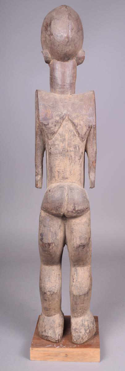 A Lobi standing female figure Burkino Faso 75cm high on a stand. - Image 4 of 4