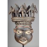 A Cameroon Grasslands blacksmith~s helmet mask Babungo/Babanki with expressive facial features and a