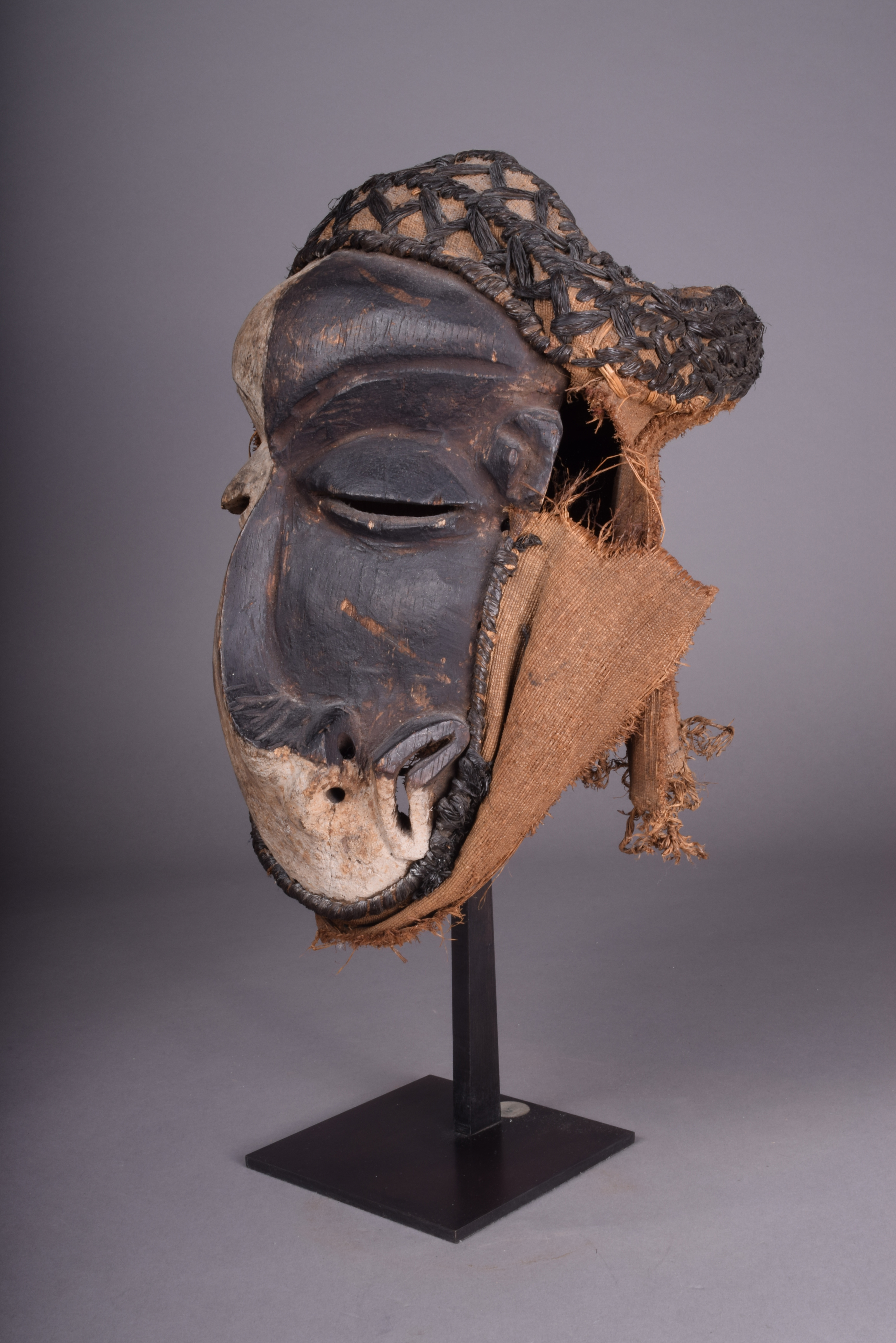 A Pende sickness mask D.R.Congo with a distorted face and with white and black pigment with fibre - Image 3 of 4