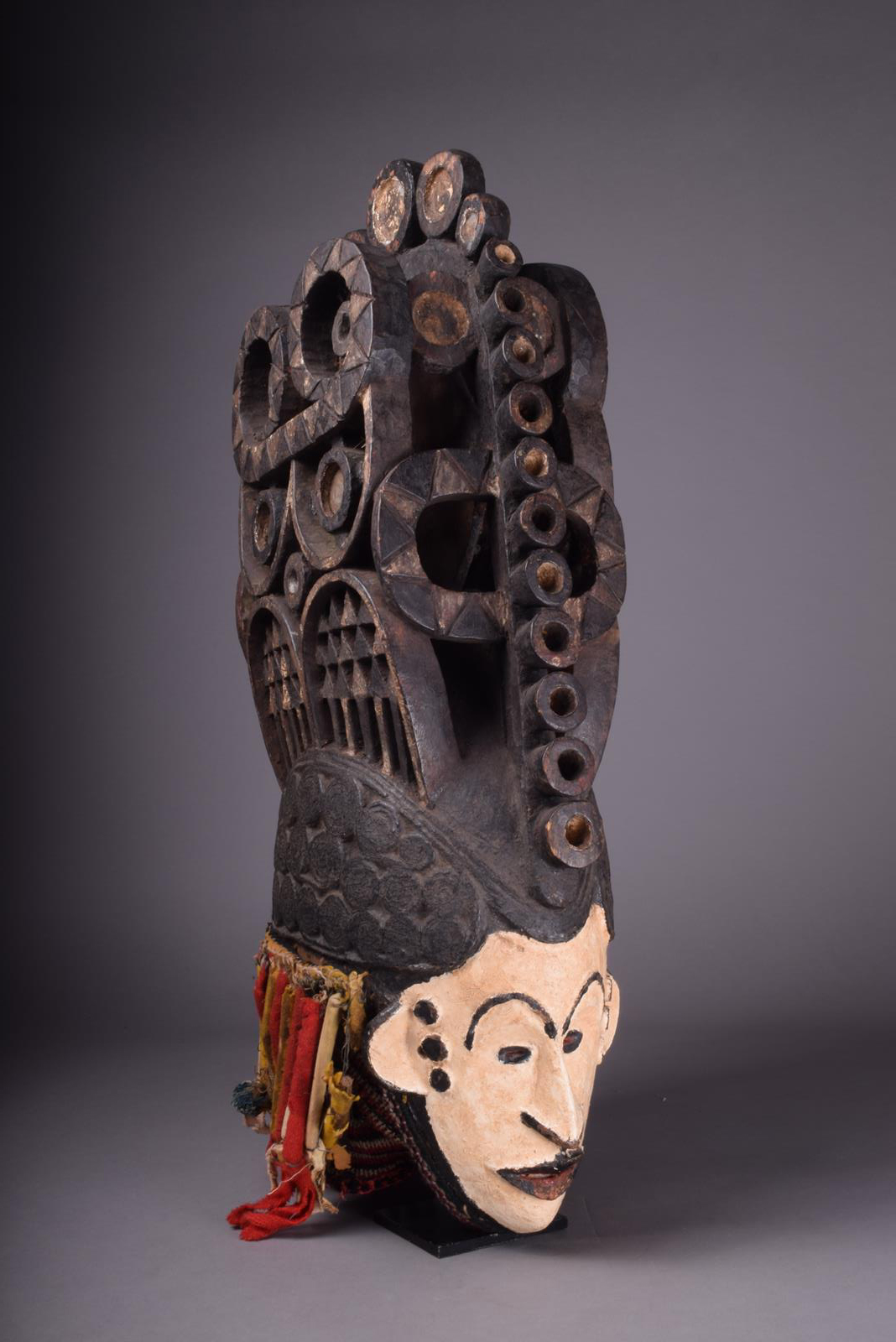 An Igbo spirit mask Nigeria with a white painted face and tight curled coiffure with a large - Image 2 of 5