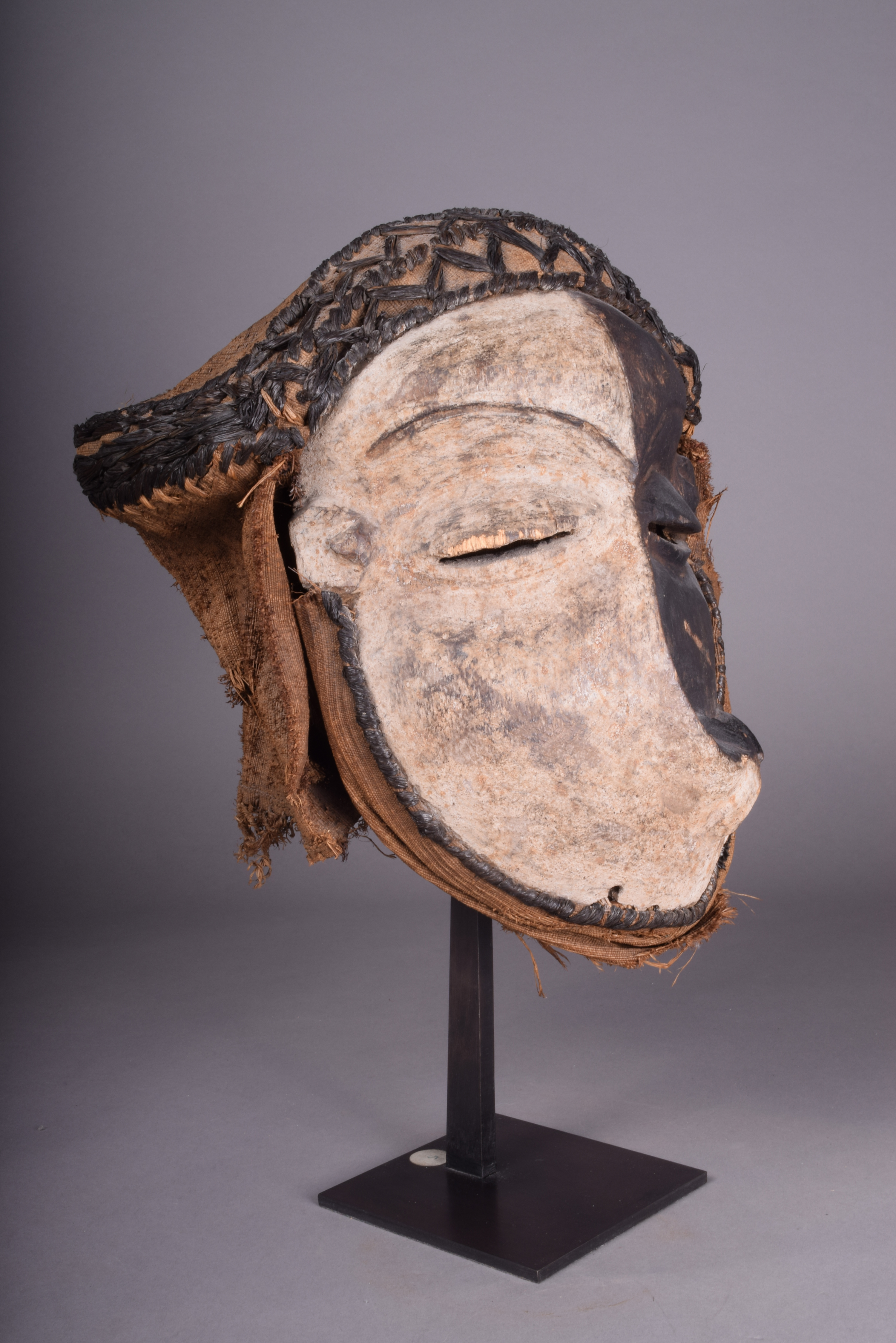 A Pende sickness mask D.R.Congo with a distorted face and with white and black pigment with fibre - Image 2 of 4