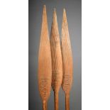 Three Oceanic paddles with grooved and panelled leaf shape blades with faceted tapering shafts 139cm