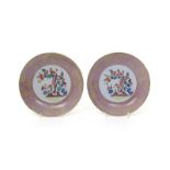 A pair of Lambeth delftware saucer dishes  c.1750, the wells decorated in polychrome enamels with