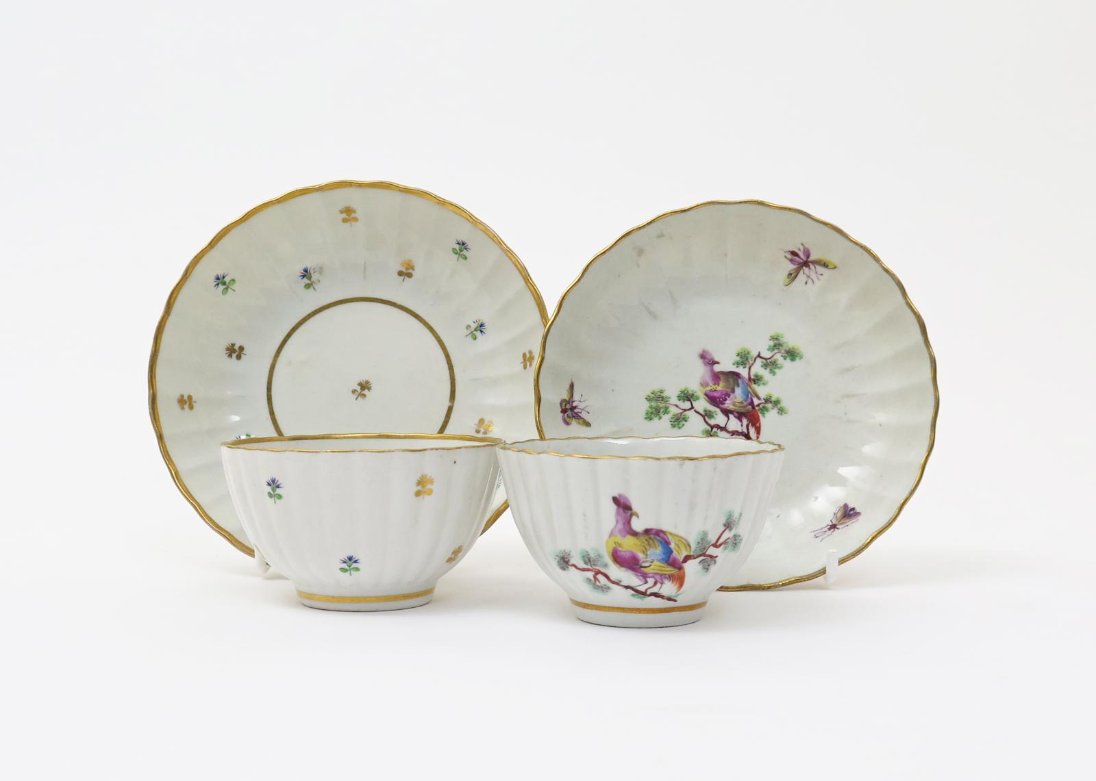 Two fluted teabowls and saucers  c.1765-75, one painted with an exotic bird perched in leafy