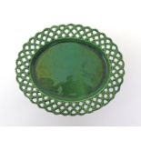 A Staffordshire green-glazed basket stand  c.1755, the oval form with a wide reticulated rim moulded