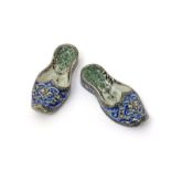 A rare pair of Qajar (Iran) pottery slippers  late 19th century, the closed pointed toes decorated