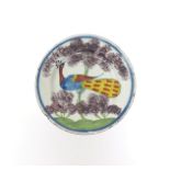 A Bristol delftware Farmhouse plate of unusually small size  c.1730, brightly enamelled with a