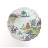 A good Nove maiolica plate  mid 18th century, the silver-shape dish richly decorated in the