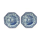 A pair of delftware octagonal plates  mid 18th century, each well painted with a figure standing