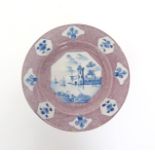 A Bristol or Wincanton delftware plate  c.1740, the well painted with an octagonal panel in blue