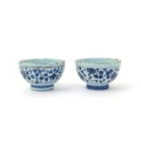 Two Delft teabowls  18th century, the generous forms decorated to the exterior with continuous bands