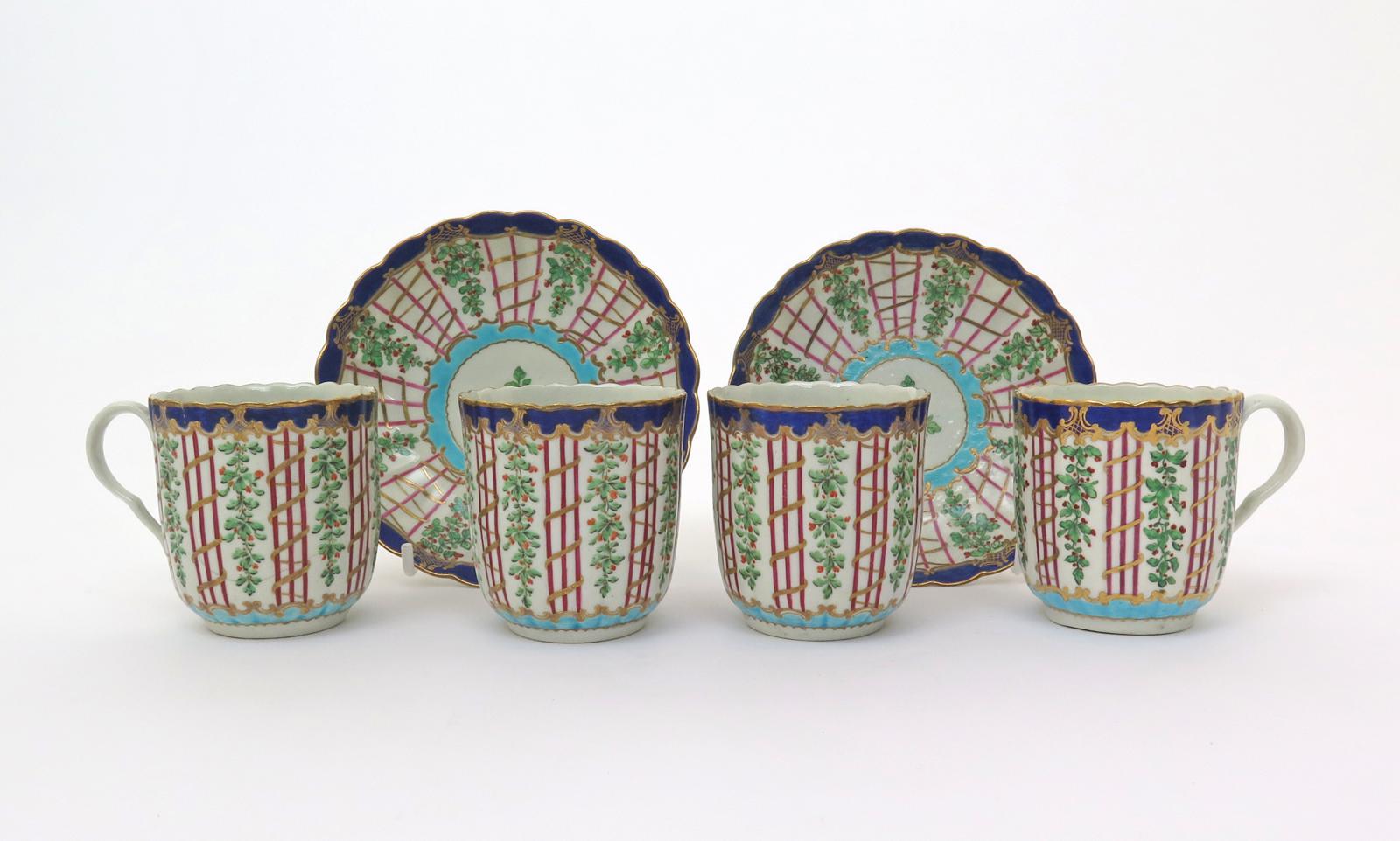 Four Worcester coffee cups and two saucers  c.1775, the fluted forms decorated in a version of the