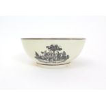 A large creamware punch bowl  late 18th century, printed to the outside in black with three