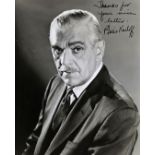 A collection of photographs and autographs comprising: Boris Karloff: a black and white