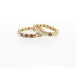 Two ruby and diamond full circle eternity rings, with opposingly mounted stones, in yellow gold.