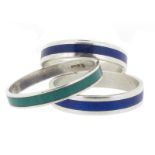 Three silver and enamel rings by Wendy Ramshaw, two rings applied with a central band of blue