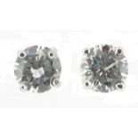 A pair of diamond stud earrings, the round brilliant cut diamonds weigh approximately 0.95cts in