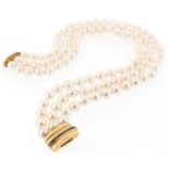 A three row cultured pearl choker, on a yellow gold clasp set with a line of calibré-cut