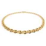 A curb-link necklace by Garrard, the design with alternating brushed and plain links in 18ct