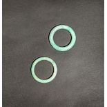 TWO CHINESE JADEITE BANGLES, MODERN The stone in bright green tones, 8cm. (2) Please note the stones