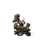 A CHINESE BRONZE MODEL OF A BUDDHIST LION DOG AND HER PUPPY, 17TH CENTURY In two parts, the bitch