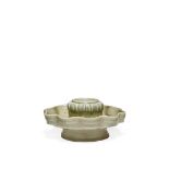 A CHINESE QINGBAI CUP STAND, SONG DYNASTY 960-1279 AD The lobed dish raised on a flaring foot, the