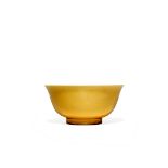 A CHINESE YELLOW GLAZED BOWL, KANGXI 1662-1722 The gently flaring body raised on a straight foot,