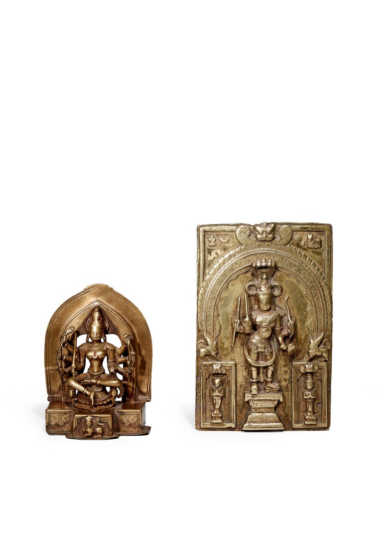 AN INDIAN BRASS SEATED FIGURE, 19TH CENTURY OR EARLIER Seated before a mandala, with her eight