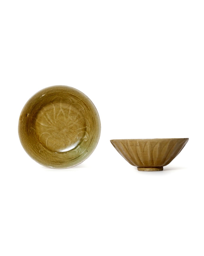 TWO KOREAN CELADON GLAZED BOWLS, C.12TH CENTURY One of conical form, carved to the exterior with