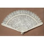 † A CHINESE CANTON IVORY BRISE FAN, EARLY 19TH CENTURY Delicately carved with many figures engaged