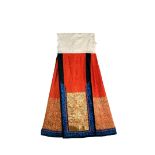 A CHINESE ORANGE SILK SKIRT IN THE FORM OF A PAIR OF APRONS, 19TH CENTURY Finely embroidered in gold