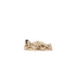 † A CHINESE IVORY EROTIC FIGURAL CARVING, LATE QING DYNASTY Carved as a woman reclining on an