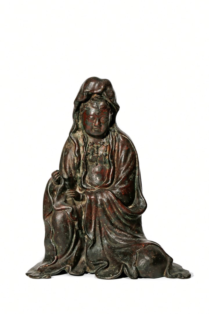 A LARGE BRONZE FIGURE OF GUANYIN, 19TH CENTURY Seated with her right knee raised, her robes