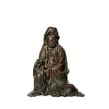A LARGE BRONZE FIGURE OF GUANYIN, 19TH CENTURY Seated with her right knee raised, her robes
