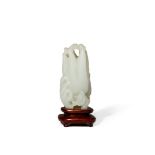 A CHINESE PALE CELADON JADE CARVING OF A FINGER CITRON, 18TH/19TH CENTURY With smaller fruits and