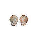 A PAIR OF CHINESE POTTERY OVOID JARS, EARLY TANG DYNASTY 618-907 AD Painted with a continuous design