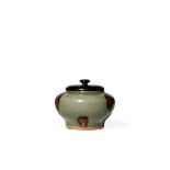 A CHINESE SMALL LONGQUAN CELADON JAR, MING DYNASTY The compressed circular body decorated with