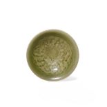 A CHINESE YAOZHOU SMALL DISH, JIN DYNASTY 1115-1234 AD The gently flaring body carved to the