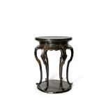A SMALL CHINESE BLACK LACQUER SIX-LEGGED STAND, YUAN DYNASTY 1271-1368 The circular top supported by